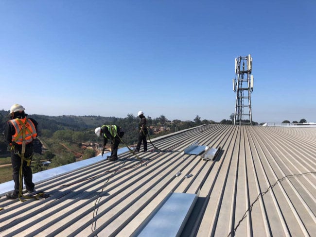 Tradies working on a rooftop