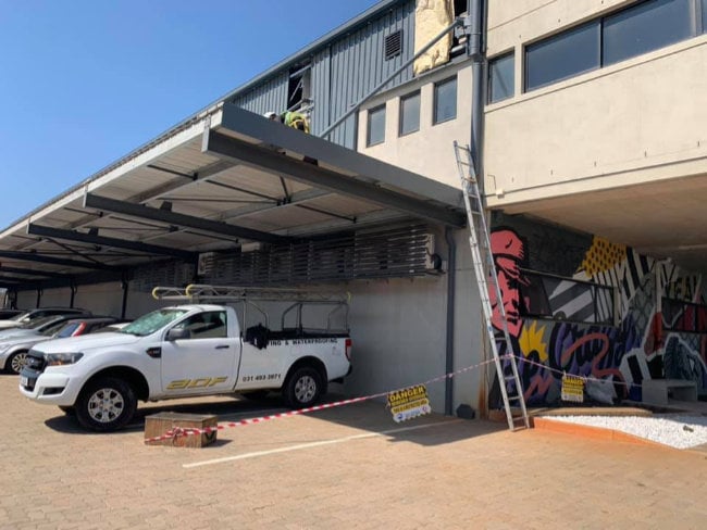 Tradies working on a rooftop