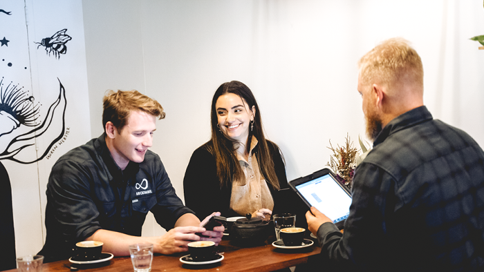 group of people having a meeting in a cafe