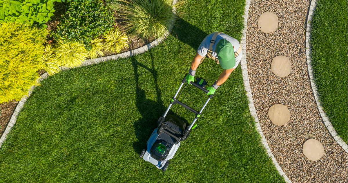 Aerial shot of man mowing lawns