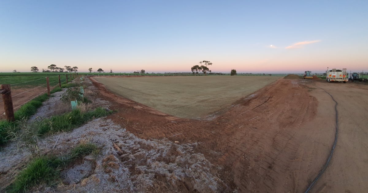 Moving earth in a field on a beautiful morning at dawn