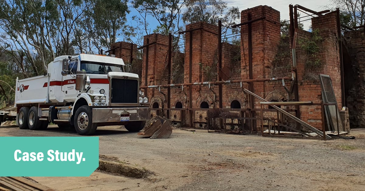 Bowden Dump Truck parked infront of an old brick kiln