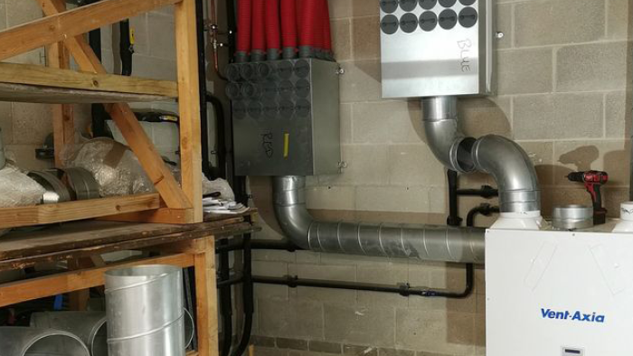 steel piping around Vent Axia HVAC system