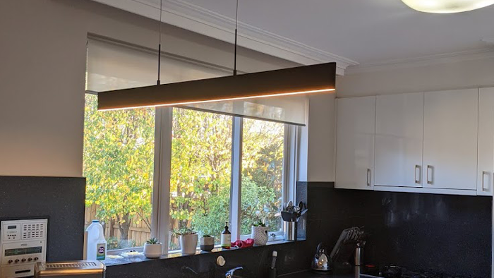 modern kitchen with down light plus contemporary chandelier