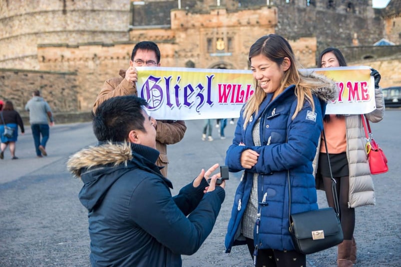 Deana's brother proposes to his girlfriend in front of a castle
