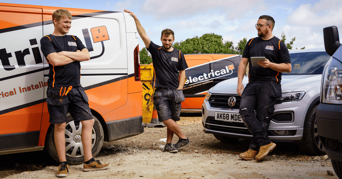 Electricians outside van waiting to start an EICR