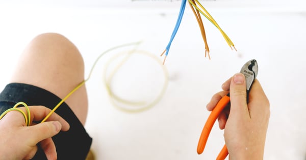 Electrician working with wires-min