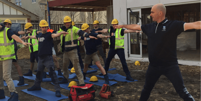 Tradespeople doing yoga