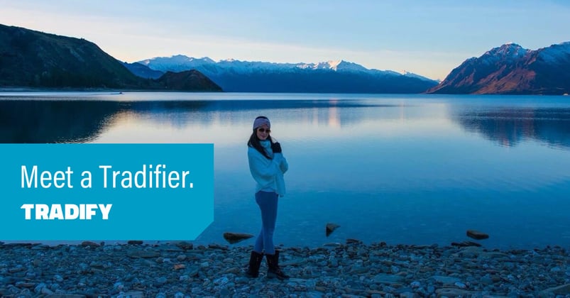 Meet a Tradifier heading with a  photo of Deana standing next to a beautiful big lake