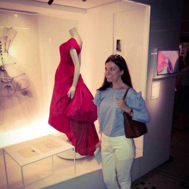 Marta looks very happy while visiting a fashion exhibition