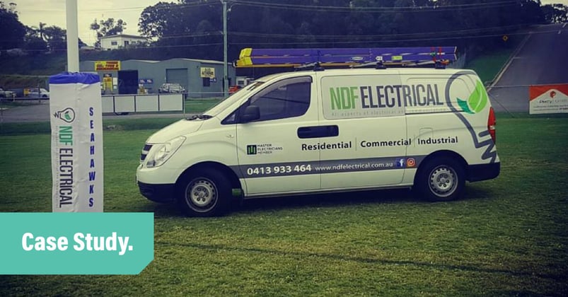 A white NDF Electrical van parked under the goal post on a rugby field