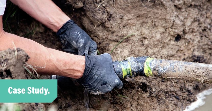 Tradify-Case-Study-of-Patrick-Reid: Holding pipe in the ground