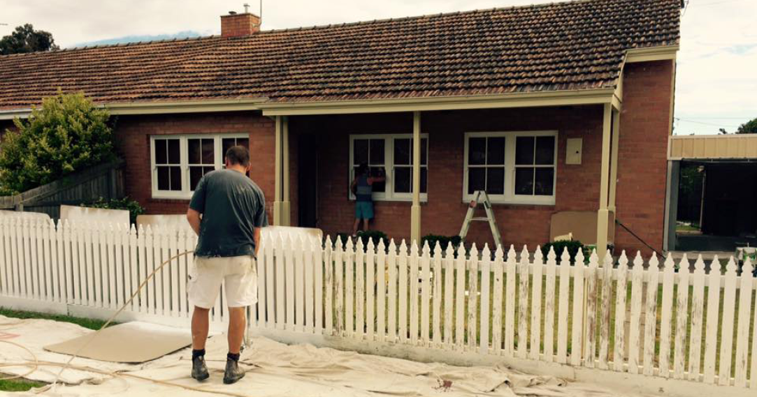 master painters_painting a white picket fence 