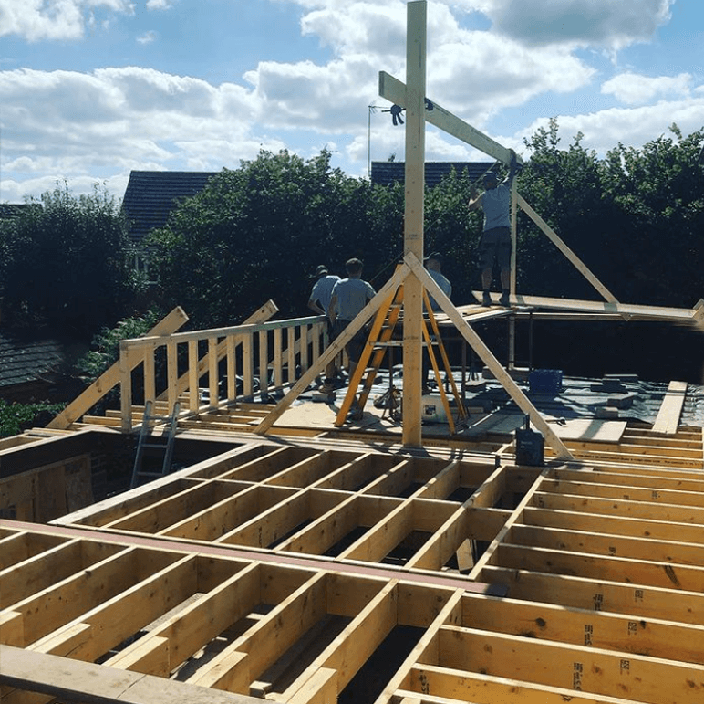 Builders at Green Hawk construction working on a house build