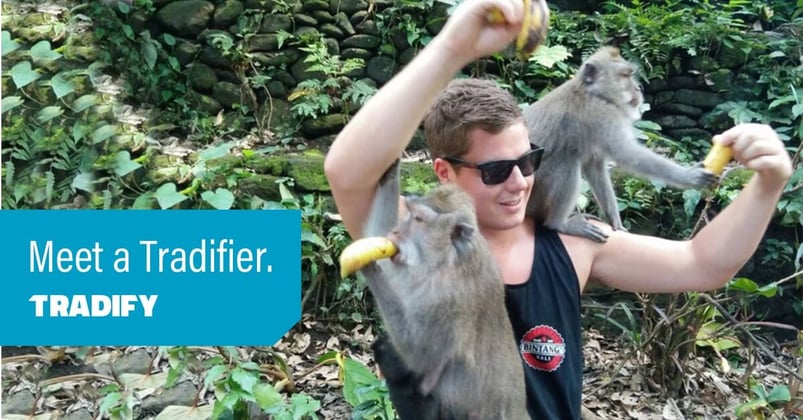 Meet a Tradifier heading over a photo of Andrew feeding bananas to monkeys